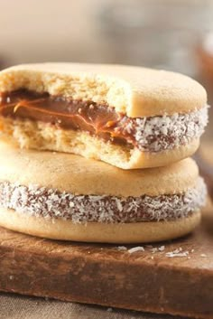 two cookies with peanut butter and powdered sugar are stacked on top of each other