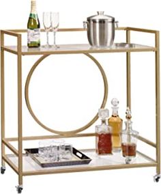 a bar cart with bottles and glasses on it