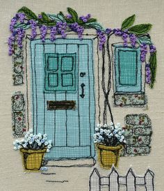 a blue door with purple flowers on it