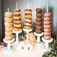 there are many donuts that are on the table and ready to be eaten at this party