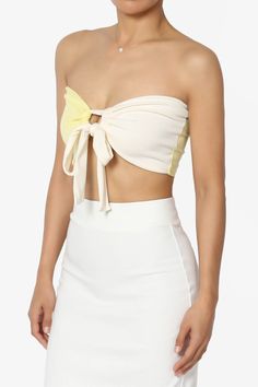 Embrace a playful yet chic vibe with our Colorblock Bow Knot Tie Front Bandeau.This eye-catching Strapless Crop Top features a bold colorblock design, accented with a charming bow knot for a touch of femininity.The ribbed texture adds a modern twist, making it perfect for pairing with over a tank top and high-rise jeans or flowy maxi skirts.Ideal for sunny days out or stylish evenings, it's a versatile addition to your wardrobe. Add this must-have top to your collection and turn heads with every stepColorblock design bandeau, ideal for summer parties or beach outgoingBow knot tie front detail, Double-lined front, No wireRibbed texture for a trendy look, perfect for high waisted jeans or skirtsStrapless style for a chic and stylish outfitModel size : 5'3" height, 33" bust, 24" waist, 34" hi Fitted Crop Top With Contrast Color For Summer, Chic Strapless Tops With Bow, Summer Yellow Tops With Contrast Color, Yellow Summer Tops With Contrast Color, Chic Yellow Tube Top For Beach, Yellow Tops With Contrast Color For Summer, Chic Yellow Tube Top For The Beach, Color Block Tops For Party Spring, Chic Multicolor Bandeau Tube Top