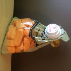 a bag of carrots sitting on top of a wooden table