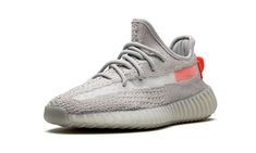 The adidas Yeezy Boost 350 V2 “Tail Light” combines elements of different Yeezy 350 V2 designs into one for a new take released in Winter 2020.  Once proclaiming “Yeezys for all,” Kanye West has indeed lived up to his word by continuing to release a steady stream of Yeezy Boost 350 V2s.  Taking cues from the “Beluga” and “True Form” colorways, the upper is outfitted in grey Primeknit with a the translucent side stripes given an orange backing near the ankle.  The bright orange hue extends onto t Light Shoes, Adidas Yeezy 350 V2, Yeezy Season, Adidas Yeezy 350, Yeezy 500, Lit Shoes, Yeezy Boost 350 V2, Yeezy 350, 350 V2