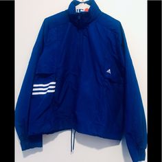 Adidas Id Woven Shell Blue/White Jacket Size M. Has Hidden Hood In Collar And Hidden Drawstring Waist. Two Front Pockets With Zippers. Brand New With Tags. Blue Adidas Sporty Windbreaker, Adidas Blue Sporty Windbreaker, Sporty Blue Adidas Windbreaker, Blue Adidas Windbreaker For Spring, Adidas Blue Windbreaker For Spring, Adidas Blue Spring Windbreaker, Adidas Originals Jacket, Hidden Hood, Adidas Zip Up