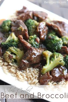 beef and broccoli over rice on a plate