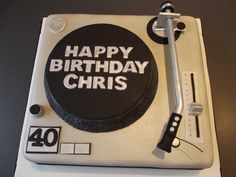 a birthday cake that is shaped like a turntable