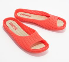 Sleek, simple, and oh-so-comfy, these slide sandals are ready for those relaxing evenings on the deck, hot summer days by the pool, and weekend trips to the beach. From Camper.\n\nOriginal item is A473218. This product may be a customer return, vendor sample, or on-air display and is not in its originally manufactured condition. It may not be new. In some instances, these items are repackaged by QVC. Open Toe Flip Flops For Beach Season Leisure, Summer Leisure Open Toe Slides, Summer Vacation Slides With Rubber Sole, Leisure Open Toe Slides For Summer, Open Toe Slides For Summer Leisure, Summer Open Toe Slides For Leisure, Summer Slip-on Slides For Outdoor, Summer Slide Slippers For Leisure, Summer Leisure Slide Slippers