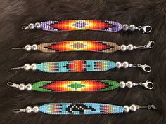 Beautiful handmade Navajo Hand Beaded Cuffs Bracelets Handcrafted by Navajo Artist R. Sellers🌷 Present in virtually every Native American tribe, the feather symbol is universally recognized as a representation of trust, strength, wisdom, freedom, and honor. Incorporated into many sacred pieces of Native American wear, the feather is easily one of the most respected symbols. Southwestern Style Handwoven Bracelets, Feather Symbol, Comanche Indians, Feather Symbolism, Bracelet Cuffs, Cuffs Bracelets, Native American Earrings, Beaded Cuff Bracelet, Child Baby