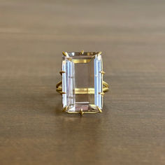 A stunning, picturesque smoky quartz alluringly grasped by a hand-fabricated multi-prong setting. 

18k yellow gold 
Smoky quartz 13mm x 20mm (1/2" x 3/4") Emerald Cut Ring, Newport Rhode Island, Handcrafted Rings, Fine Rings, Smoky Quartz