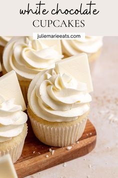 cupcakes with white chocolate frosting on a wooden cutting board and text overlay that reads, how to make white chocolate cupcakes