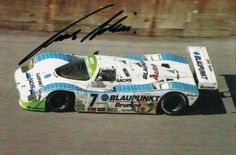 an autographed photo of a racing car