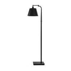 a floor lamp with a black shade on it