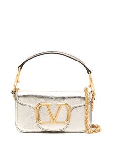 gold-tone calf leather gold-tone hardware metallic effect VLogo Signature foldover top with magnetic fastening main compartment internal slip pocket internal logo stamp detachable shoulder strap detachable chain-link shoulder strap Metallic Handbags, Valentino Garavani Bag, Silver Bags, Gold Bag, Valentino Bags, Logo Stamp, Cute Bags