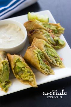 some food is on a white plate with a small bowl of ranch dressing next to it