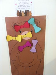 a paper bag with a bear and bow tie on it