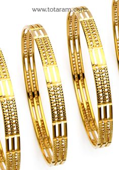 22 Karat Fine Gold Bangles - Set Of 4 (2 Pair)  Discover the epitome of elegance with our 22 Karat Fine Gold Bangles - Set Of 4 (2 Pair) from Totaram Jewelers. Handcrafted in India, these exquisite bangles are a testament to the rich heritage of Indian craftsmanship.     Made from 22 Karat Gold, these bangles boast a total gross gold weight of 54.300 grams, ensuring a luxurious feel and a radiant shine. Designed for women in the adult age group, these bangles are the perfect accessory to elevate Gold Bangle Set, India Gift, Bangles Set, Bangles Design, Gold Bangles Design, Bangle Designs, Gold Jewelry Indian, Bangle Set