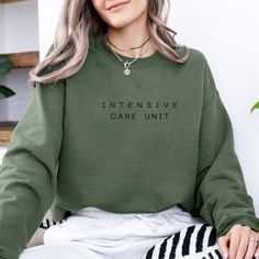 Embrace comfort and style with our Intensive Care Unit Sweatshirt--a perfect blend of coziness and statement design. Whether you're an ICU worker, a healthcare hero, or simply a fan of unique apparel, this sweatshirt brings warmth and inspiration to your wardrobe. ✨ Soft & Cozy: Crafted from premium, breathable fabric, it's your go-to for cool mornings and relaxed evenings. ✨ Unique Design: Featuring a minimalist ICU-themed design, it's made for those who appreciate subtle yet meaningful fashion. ✨ Made for You: Every sweatshirt is made to order, ensuring each piece is tailored with care and quality. Why You Love It: Unmatched Comfort: Soft, plush material that feels great all day long. High-Quality Prints: Durable design that stays vibrant even after multiple washes. Perfect Fit: Customer Cotton Relaxed Fit Nursing Sweatshirt, Cotton Nursing-friendly Relaxed Fit Sweatshirt, Casual Long Sleeve Nursing Tops, Casual Cotton Sweatshirt For Nursing, Casual Nursing Top With Crew Neck, Casual Nursing Tops With Relaxed Fit, Relaxed Fit Nursing Tops With Crew Neck, Gift For Nurse, Intensive Care Unit