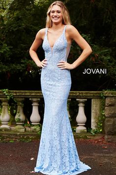 Elevate your evening look with the Perri lace fitted gown by Jovani 48994! This stunning dress features delicate lace embellished with sparkling heat set stones, a plunging V neckline with sheer mesh, and a low V back. The fitted silhouette and sweeping train create a flattering and elegant look. Jovani Prom Dresses, Blue Gowns, Fitted Gowns, Fitted Prom Dresses, Jovani Prom, Prom Dresses Jovani, Lace Prom Dress, Sleeveless Gown, Pageant Gowns