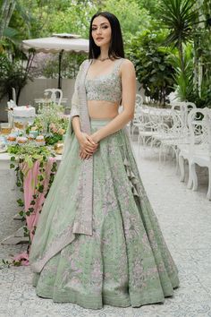 Pistachio green lehenga with bead embellishment in floral motifs and cutwork detail on the waistband. Comes with sleeveless blouse and dupatta.
Components:3
Pattern:Embellishment
Type of Work:Bugle Beads, Cutdana and Sequin
Neckline:Sweetheart
Sleeve Length:Sleeveless
Fabric:Silk Organza
Color:Green
Other Details:
Blouse with cutwork detail
Dupatta with embroidered border
Tie up on the side
Occasion:Wedding - Aza Fashions Bottle Green Lehenga, Varun Chakkilam, Embroidered Bridal Lehenga, Green Lehenga, Bugle Beads, Bottle Green, Silk Organza, Designer Gowns, Green Silk