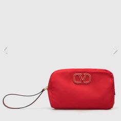 Valentino Garavani Large Cosmetic Case In Red Satin Exterior And Lining With Antique Gold-Tone Hardware. Made In Italy. Measures Approx 8.5w X 5.5h X 2.5d. Zip Around Top Closure With Leather Wrist Strap. Interior Slip Pocket. Metal And Acrylic Logo Detail At Front. Vent-Wy616. Uw2p0u67prv. Comes With Dust Bag And Authentication Cards Luxury Red Formal Pouch, Elegant Red Travel Pouch, Red Evening Pouch, Acrylic Logo, Valentino Clutch, Valentino Garavani Bag, Leather Cosmetic Bag, Satin Bags, Trending Handbag