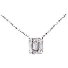 This is a very special, unique piece. This Art Deco Style designed diamond pendant is truly stunning. The emerald diamond shape is made of an emerald cut diamond set in the center with baguette diamonds framing the sides and four round brilliant diamonds connecting the corners. The diamonds are set perfectly to give an overall emerald diamond shape with an Art Deco set style. The pendant is on a 14 karat white gold, 16 inch chain that compliments the design perfectly! This necklace looks amazing Art Deco Pendant Necklace, Art Deco Emerald, Solitaire Diamond Pendant, Baguette Diamonds, Emerald Cut Diamond, Set Style, Art Deco Necklace, Sapphire Pendant, Estilo Art Deco