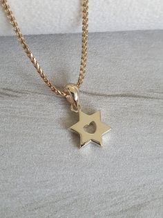 14k shiny Gold Star of David Pendant with Heart, Jewish Jewelry, Bar mitzvah gift, Unique Jewish pendant, necklace pendant, solid gold pendant For people who love simple and delicate jewelry, this pendant is perfect for you, made of 14k yellow gold, the Star of David is an important symbol for the Jewish people throughout the centuries, at Ben Jewelry you can find a large and impressive collection of shields of David in different shapes and sizes, you are welcome to take a look.    Choose to pur Jewelry Bar, Star Of David Necklace, Necklace Bar, Judaica Jewelry, Jewish Jewelry, Star Of David Pendant, Jewish People, Rosh Hashanah, Rose Gold Chain