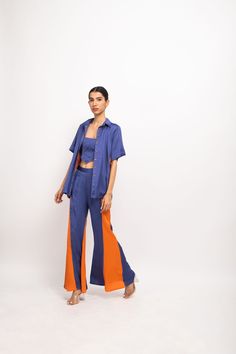 Blue-Orange three piece co-ord set; blue halter neck bustier paired with blue-orange panelled shirt and blue-orange panelled flared pants.Party Wear, Casual, Office Wear, Day Wear, Holiday Wear Fabric : Bemberg Modal Silk Blue-Orange Color Butter Crepe Lining Colorblocked Pattern 7-14 days Delivery Dry clean only Summer Blue Pant Set With Short Sleeves, Blue Two-piece Sets With Short Sleeves, Blue Short Sleeve Pant Set For Summer, Blue Wide Leg Summer Sets, Party Wear Casual, Casual Office Wear, Silk Dresses, Pop Up Event, Holiday Wear