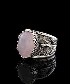 Gorgeous and unique, this filigree art rose quartz gemstone tulip detailed 925 sterling silver women's statement ring will be the center of attention! Handmade for a one-of-a-kind look, it's sure to spark conversation and admiration from all who see it. Why not treat yourself to standout style? The oval-cut cabochon rose pink quartz stone is 10x14 mm and is bezel set. The ring face measures 0.60" x 0.45" and the band width is 1.20 mm. The statement ring is oxidized and highly polished for catchi Elegant Rose-colored Jewelry With Rose Design, Elegant Rose Flower Ring As Gift, Elegant Rose Flower Ring For Gift, Elegant Rose Colored Flower Ring As Gift, Elegant Rose-colored Flower Ring For Gift, Elegant Rose-colored Flower Ring As Gift, Elegant Pink Flower Rings, Elegant Pink Flower Shaped Rings, Elegant Pink Flower-shaped Rings