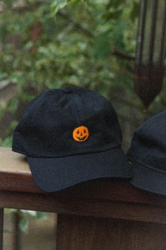 Inspired by the simple pumpkin designs of 90's Halloween info: 6 panel baseball cap (Dad Hat), adjustable sizing Fun Curved Brim Baseball Cap For Streetwear, Halloween Black Snapback Baseball Cap, Black Halloween Snapback Baseball Cap, Fall Streetwear Baseball Cap, Black Snapback Baseball Cap For Halloween, Curved Brim Hats For Fall Streetwear, Halloween Snapback Baseball Cap For Streetwear, Black Snapback Cap For Halloween, Fun Streetwear Dad Cap