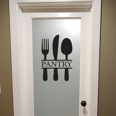 a door with the words pantry on it and forks and spoons painted on it