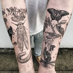 two people with tattoos on their legs, one is holding a butterfly and the other has moths