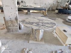 a marble table sitting in the middle of a room