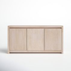 a wooden cabinet sitting on top of a white floor