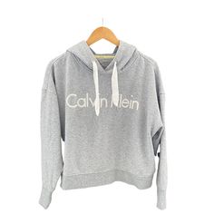 Calvin Klein Performance Cropped Women’s Sweatshirt Size Xl 60% Cotton 40% Polyester Grey Body With White Calvin Klein Embroidered Name Hooded With Cream Pull/Tie Machine Wash @Mfitzee Is For Anyone Who Wants To Stay Up-To-Date With The Latest Trends. We Offer An Assortment Of Clothing, Jewelry, Accessories, And Home Goods From Hundreds Of Your Favorite Brands. We Offer Brand New, Like New, And Pre-Owned Clothing And Accessories. Our Goal Is To Provide Our Customers With Unique, Good Quality Pie Calvin Klein Cotton Tops For Loungewear, Calvin Klein Cotton Loungewear Tops, Calvin Klein Long Sleeve Tops With Logo Print, Calvin Klein Logo Print Sweatshirt For Fall, Calvin Klein Long Sleeve Logo Print Tops, Calvin Klein Cotton Hoodie With Long Sleeves, Calvin Klein Long Sleeve Hoodie For Fall, Calvin Klein Cotton Long Sleeve Hoodie, Calvin Klein Long Sleeve Cotton Hoodie