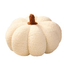 a white pumpkin sitting on top of a table