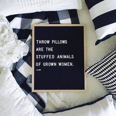 a sign that reads throw pillows are the stuffed animals of grown women on top of a blanket