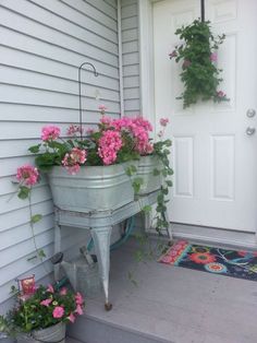 a porch with flowers on it and a potted planter