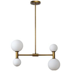 three light brass chandelier with white glass balls hanging from the ceiling, on an isolated metal rod