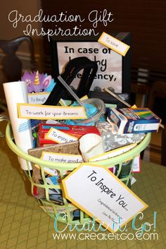 a basket filled with lots of different items on top of a table next to a sign that says graduation gifts in case of emergency