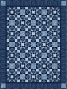 a blue and black quilt with squares on the front, one block in the middle