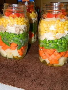 three jars filled with different types of food