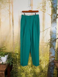 Gorgeous pair of parrot green wool Mondi trousers from Germany! Mondi is known for their quality made apparel since the 1960's. These trousers have 3 cotton lined pockets, front pleats, and cuffed legs. Such a lovely and rare color!! Belt loops, zipper and 2 button closure. Tagged size 40 waist 29" inseam 30" hips 23" across at base of zipper leg opening 16" Thanks for looking and feel free to ask so many questions! High Waist Green Bottoms With Welt Pockets, Green High-waisted Bottoms With Welt Pockets, High-waist Green Pants With Welt Pockets, High Waist Green Pants With Welt Pockets, Green High Waist Pants With Welt Pockets, Green High Waist Dress Pants With Pockets, High Waist Green Dress Pants With Pockets, Green High-waist Pants With Welt Pockets, Classic Green Cotton Pants