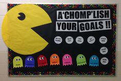 a bulletin board with pacman faces and words that read, a chomplish your goals