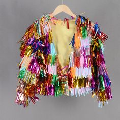 Welcome to my shop, I am in China. It will need around 20 days for international orders. Please consider the time when placing order. Quicker express DHL,Fedex,UPS available(NEED ADD SHIPPING COST). Please send us a message with any questions or deadlines before placing order! This tinsel jacket is handmade with love,perfect for concert, wedding,birthday,party,costume event,rave and so on. This item is custom design,you choose the colors. Not accept returns or replacement. TWO BODY LENGTH AVAILA Winter Party Outerwear With Tassels, Party Outerwear With Tassels, Multicolor Festive Outerwear For Festivals, Long Sleeve Party Outerwear With Tassels, Red Tinsel Jacket, Multicolor Embellished Party Outerwear, Tinsel Fringe Jacket, Rainbow Tinsel Jacket, Tinsel Dress