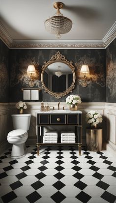 a bathroom with black and white checkered flooring, gold fixtures and a round mirror