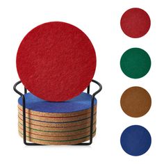 a stack of coasters sitting on top of each other with different colored circles around them