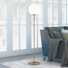 This globe and stem style floor lamp adds an airy feel to any room The white glass sphere diffuses light gently into your space, creating an elevated style The brass base complements the sleek orb shade with a clean, glamorous and contemporary look Refresh any room with this modern yet consumable floor lamp Hailey Home Theia 62.63-in Brass Floor Lamp | FL0069 Stem Style, Globe Floor Lamp, Novelty Floor Lamp, Bronze Floor Lamp, Tree Floor Lamp, Torchiere Floor Lamp, Cool Floor Lamps, Brass Floor Lamp, Stardew Valley