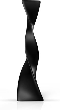 an abstract black sculpture on a white background