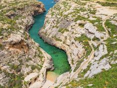 the water is blue and green in this canyon