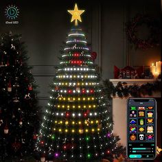 the christmas tree is lit up with colorful lights and stars on its top, next to another decorated christmas tree